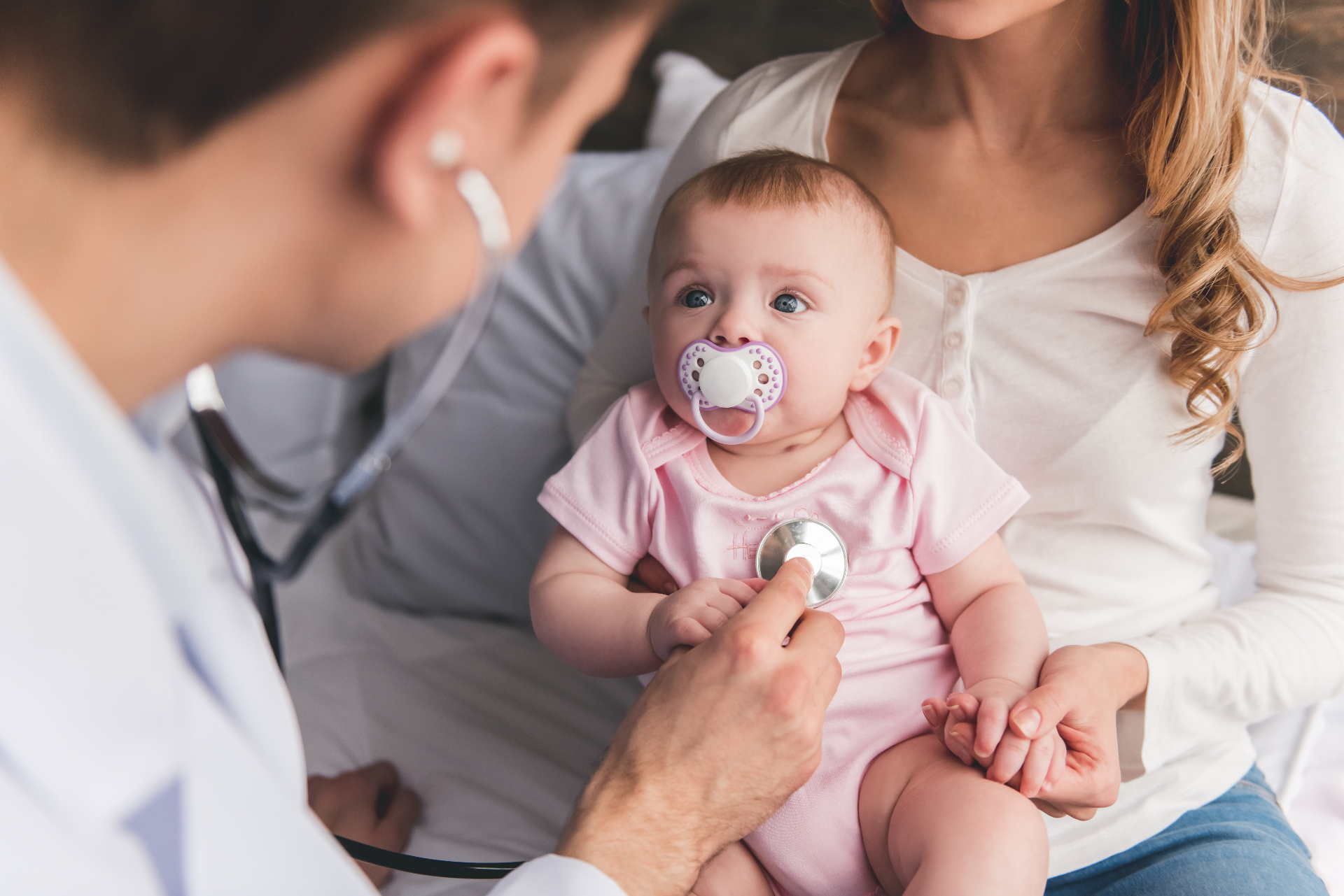 Pediatric cardiologist with young patient